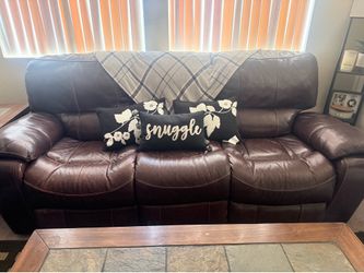 Brown fully reclining electric leather couch and chair