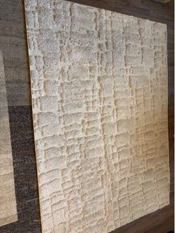 Beige rug from Ashley’s 5x7