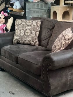 Ashley Furniture Nailhead Trim Loveseat with Pillows