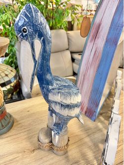 New handcrafted carved pelican on triple post