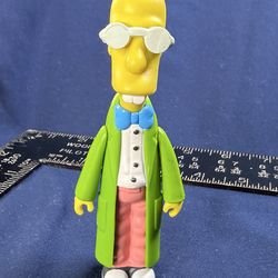 Professor Frink action figure from The Simpsons: World of Springfield Series 6 by Playmates Toys (2001).  Features Frink in his signature green lab co