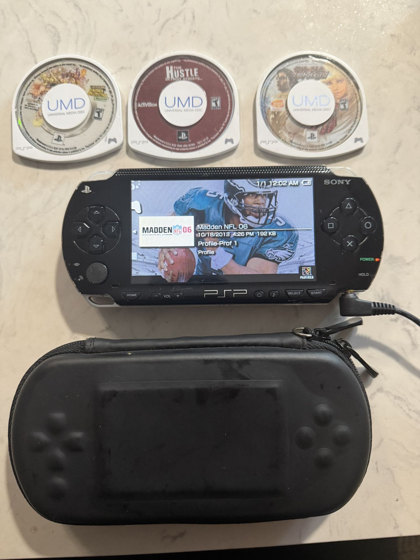Handheld Psp With Game Bundle (Charger Included)