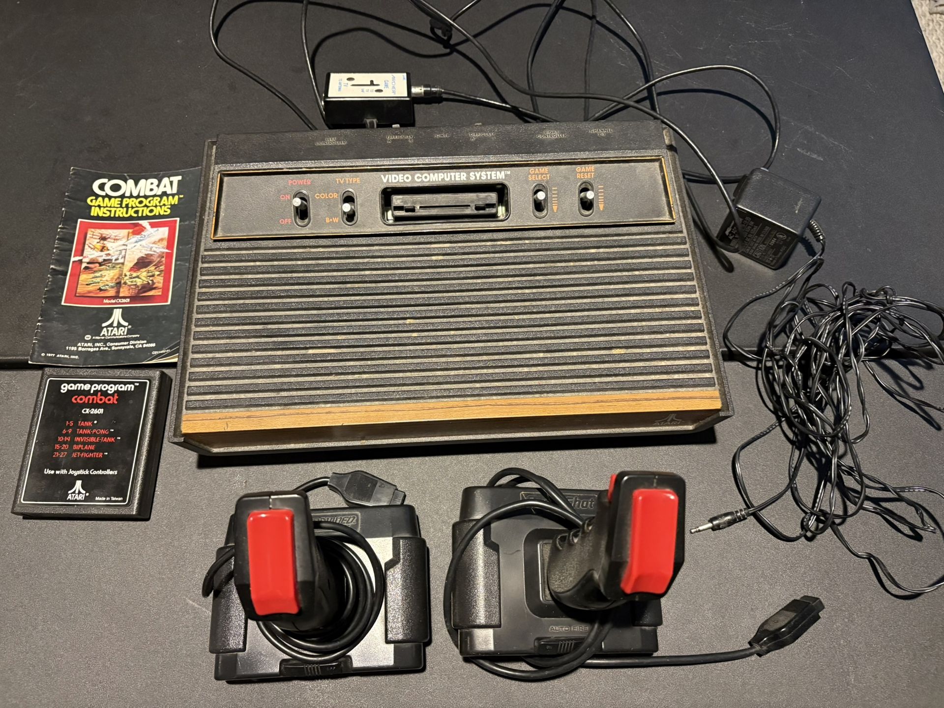 Atari 2600 Console with 2 Joysticks, Combat cartridge with manual Untested