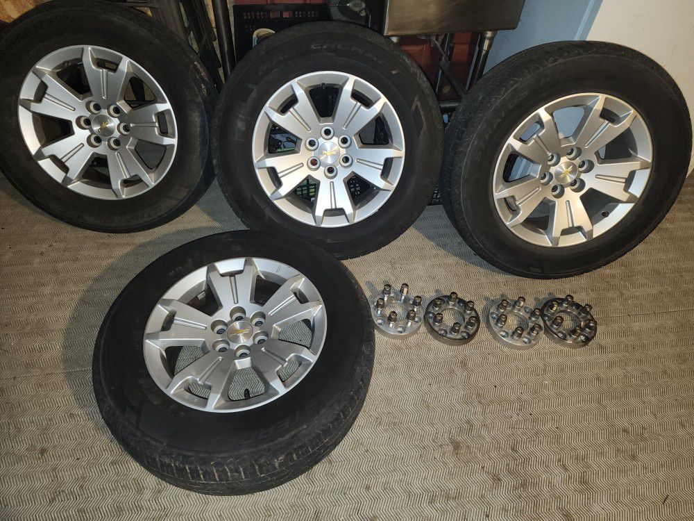 I am selling a set of wheels with 245 65 17 tires that fit Chevy Silverado and Chevy Colorado six-stud trucks with extensions.  in good condition no s