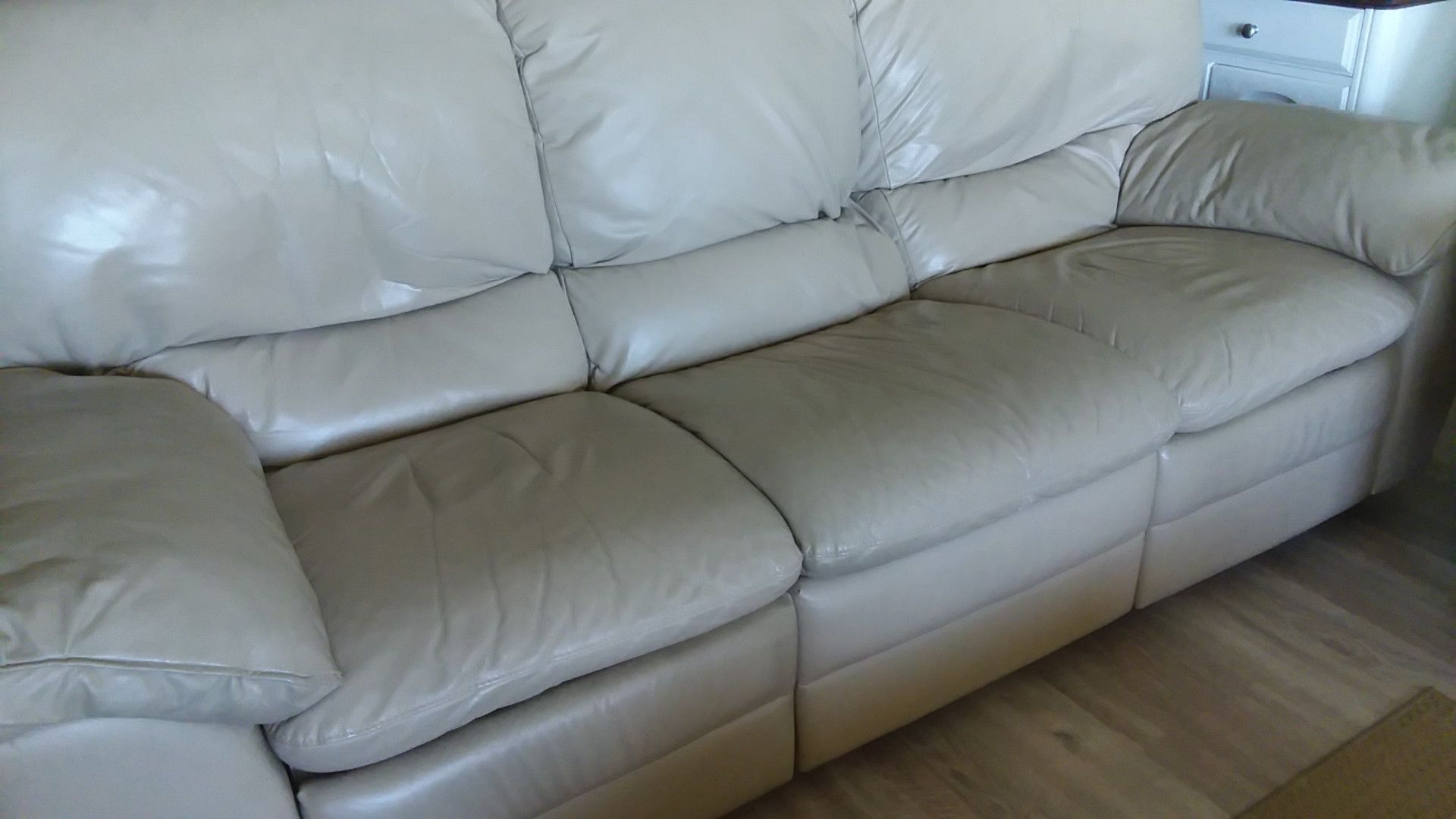 Natuzzi couch w/2 manual recliners. A steal at $250. Leather shows some usage (no rips or tears) pet free, non-smokers.