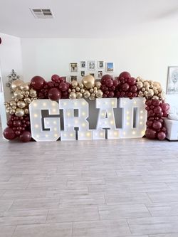 GRAD marquee letters