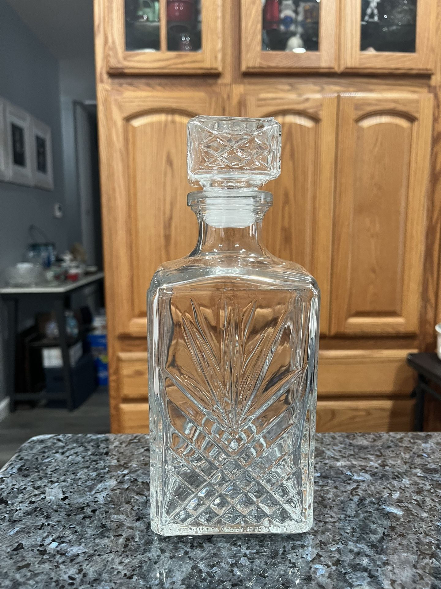 Decanter Clear Glass Square Starburst Design . Size approximately 9 inches tall. Preowned. Has been on display in a cabinet. Smoke free ho