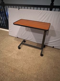 Hospital bed tray on wheels