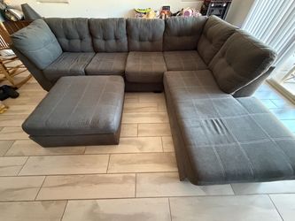Gray sectional with ottoman