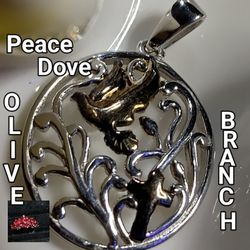14K- PEACE DOVE, ALSO WITHIN, OLIVE BRANCH,  IN STERLING SILVER, ROUND PENDANT. 18-IN STERLING CHAIN.