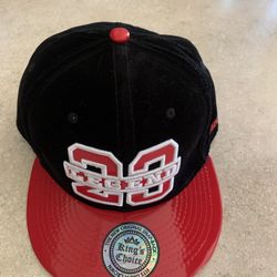 Velvet and leather-style cap with embroidered design
