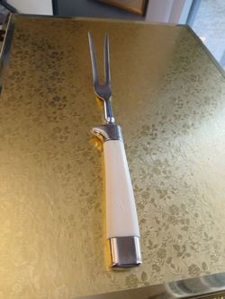 Cream handled meat fork