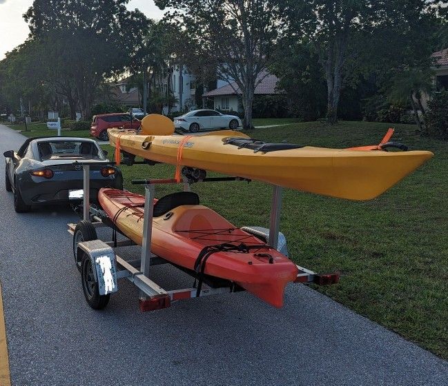 2 single kayaks + double kayak trailer
