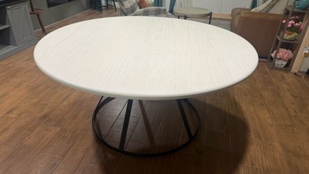 Living Spaces 64 inch round wide fits 8 chairs.  Dining table
