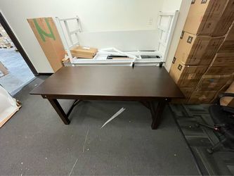 2564 $150 Large Dark Brown Wooden Table – 71” x 31” x 31” Beautiful and sturdy wooden table with a dark brown finish. Simple, classic design that wo