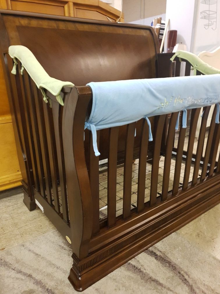 Solid wood baby crib in like new condition