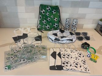 Various soccer-themed supplies, bags, sport bands, bottles, beach balls, sunglasses