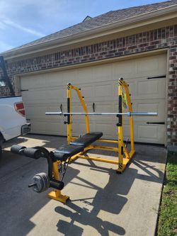 Bench set with bar and some weights for leg press