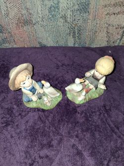 Set of two children with ducks