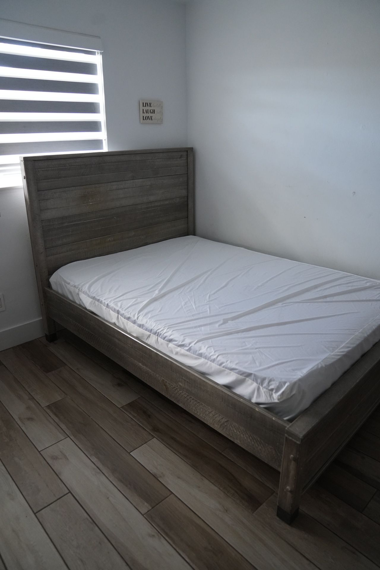 Rustic wood bed frame with clean mattress included