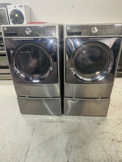 Kenmore electric washer and dryer—includes a receipt for a 90-day warranty.
