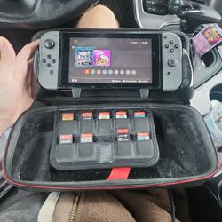 NINTENDO SWITCH 1, CARRYING CASE, SD CARD, GRIP, AND 9 GAMES. ALSO HAVE POKEMON ZA TO BUNDLE FOR THE RIGHT PRICE