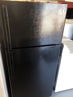 Used GE top and bottom fridge. 1 year warranty