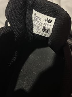 New Balance 740 sneakers in a black and silver colorway.