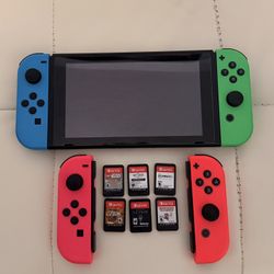 Nintendo Switch V1 Unpatched 32GB Handheld Console - 6 Games and 2 Extra Remotes