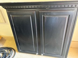 Black wooden storage cabinet