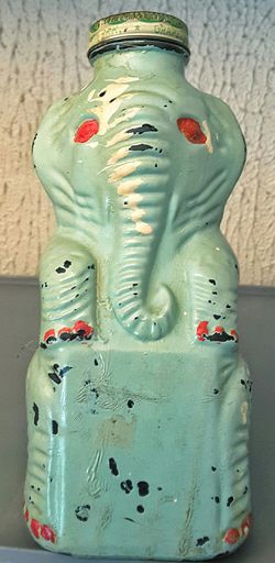 Grapette antique glass elephant figurine bottle bank in celadon green painted finish as is
