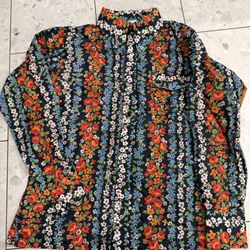 Sézane Pierro shirt featuring a colorful floral print on a black background