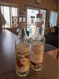 Empty Monin bottles