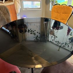 ROUND BLACK GLASS/ROD IRON DINING TABLE.