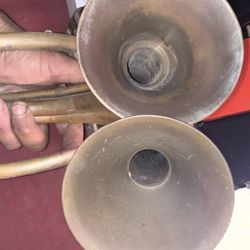 Antique made with brass and copper soldered together trumpets made in India