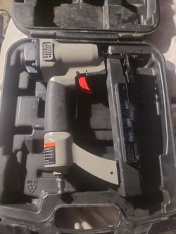 Porter-Cable pneumatic brad nailer (such as the 18-gauge BN125A or similar BN200 series) resting inside its molded carrying case.