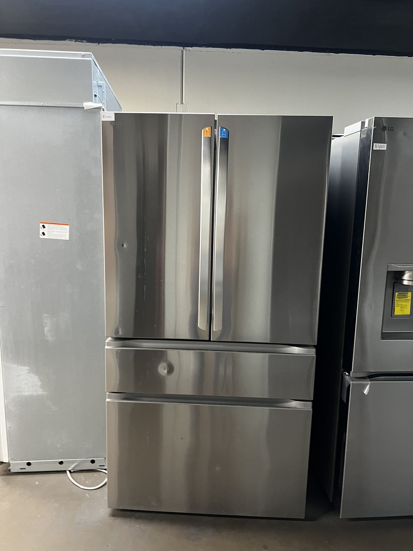 New Open Box Lg Four Door Stainless Steel Refrigerator With Indoor Water/Ice