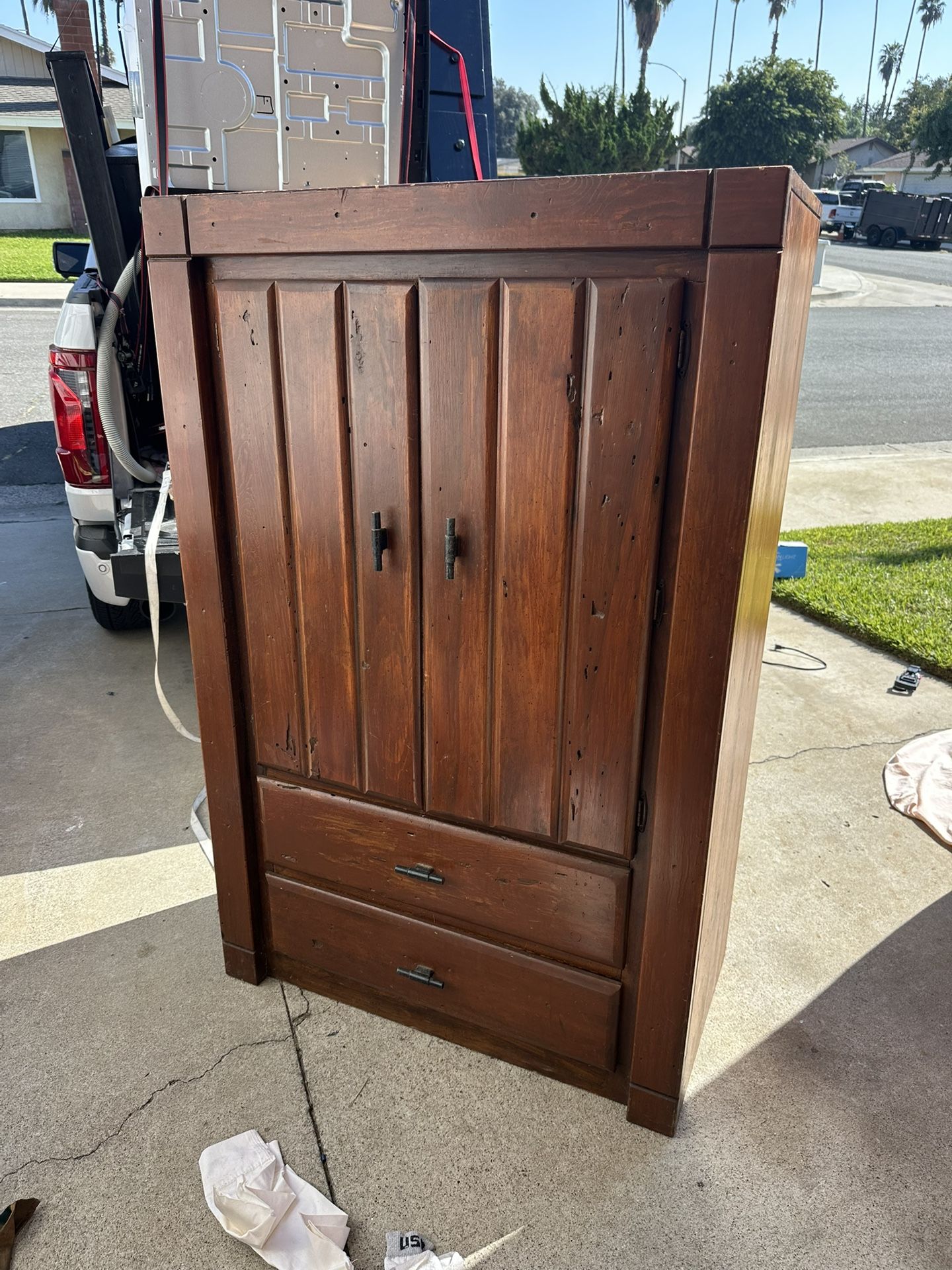 Vintage wood armoire or wardrobe closet.