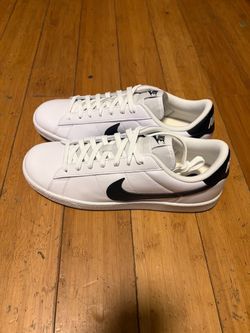 Size 10 white Nike Court Royale low-top sneaker featuring a black Swoosh logo on the side and a classic white lace-up closure.