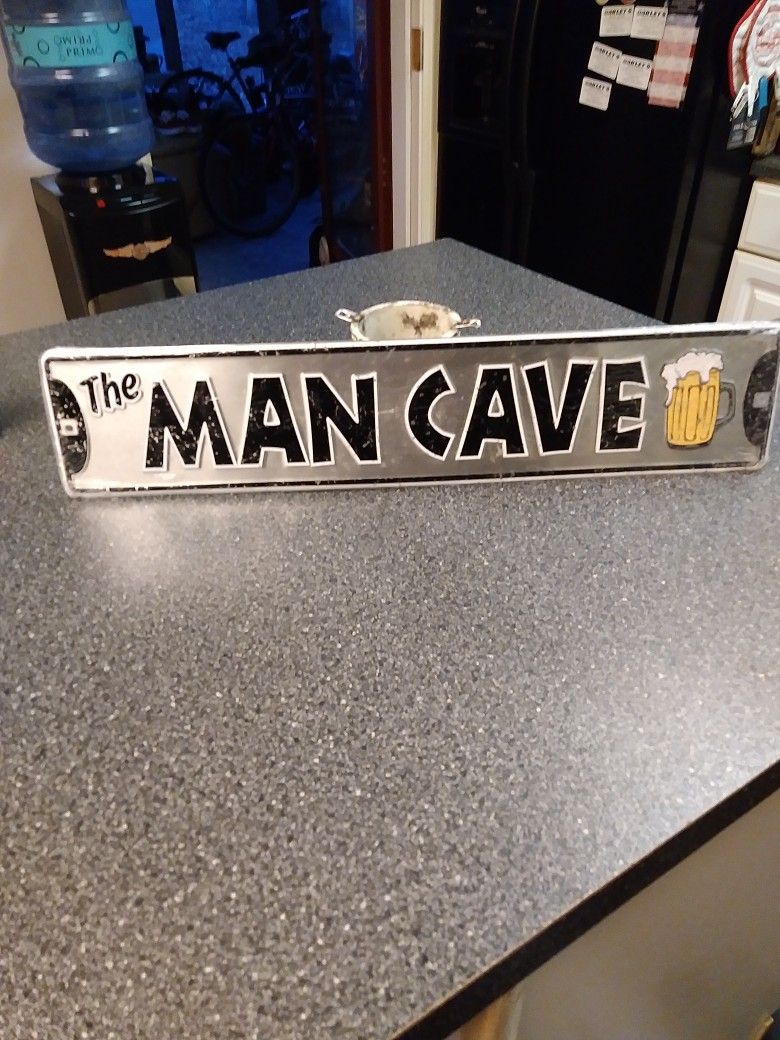 SIGN IS. 24 INCHES LONG. 5 INCHES WIDE NEW STILL WRAPED IN PLASTIC