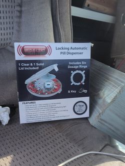 Locking automatic pill dispenser