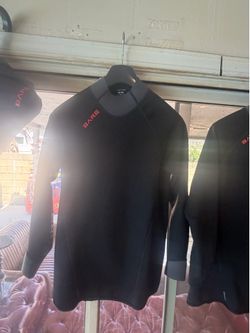 Diving/surfing pants; provide warmth when in the water and feature antimicrobial properties. EXOWEAR top (men's), size M. Matching pants also availabl