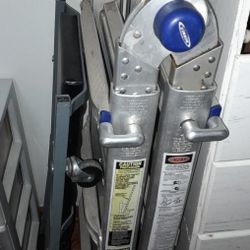 Folding Aluminum Ladder And A Machanics Creeper  