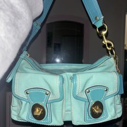 Coach Legacy 65th Anniversary Double Turnlock Shoulder Bag in a teal patent leather.
