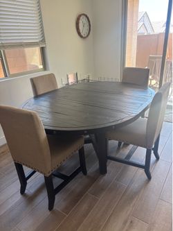 Black dining table and 4 chairs - without leaf: 54x54 circle - with leaf: 54x74 oval