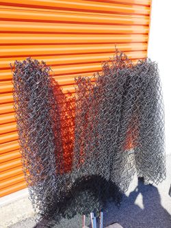 4 rolls of black chain link fence