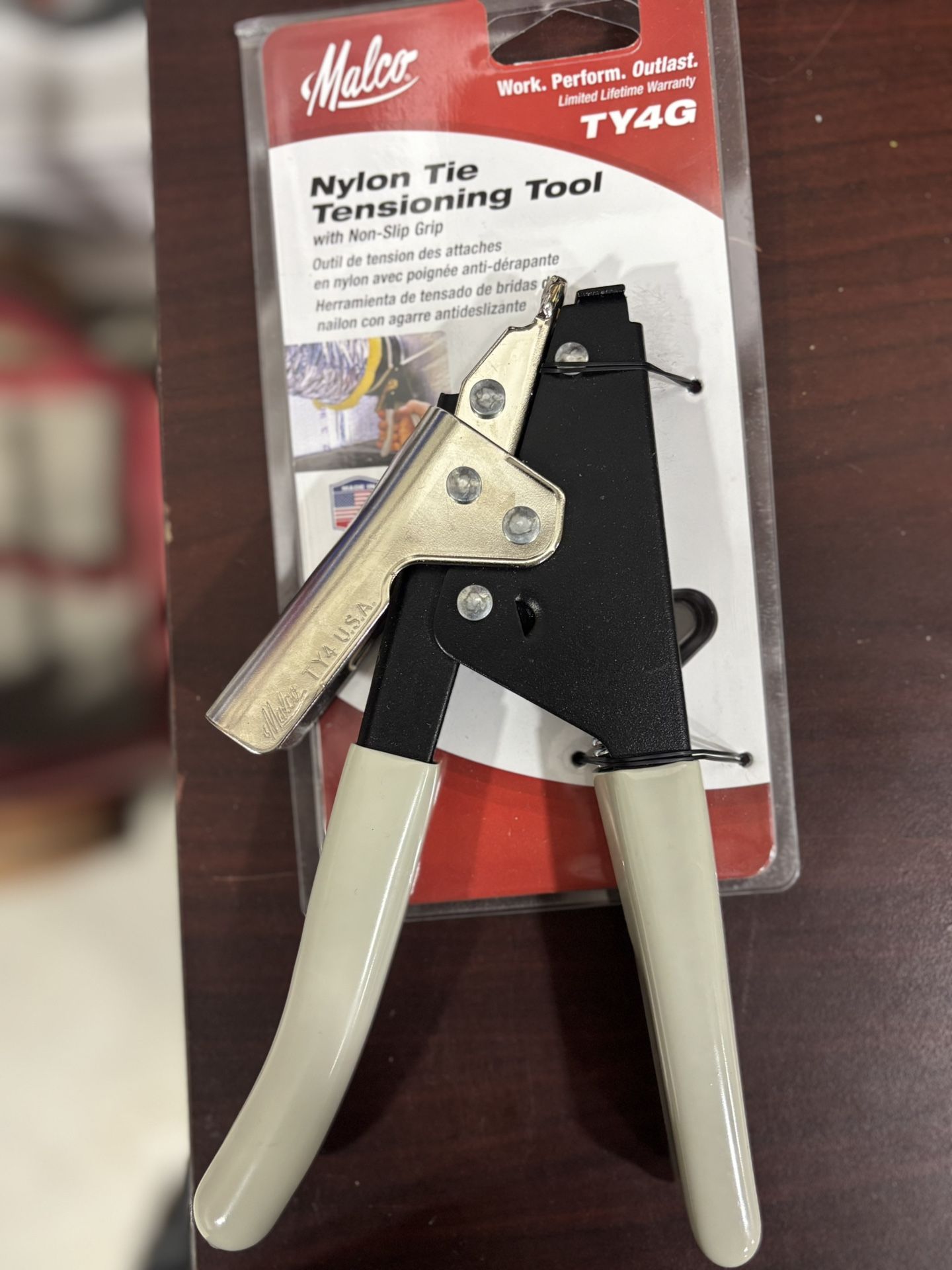 Nylon tie, tensioning tool with nonslip grip