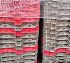 Plastic distribution totes. Fold in lids and stackable.
