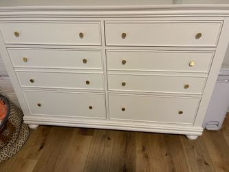 Dresser with gold knobs