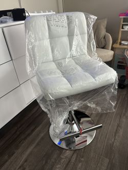 Brand new adjustable barstool, $75.